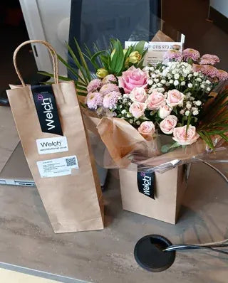 Pink flowers with a Welch gift bag