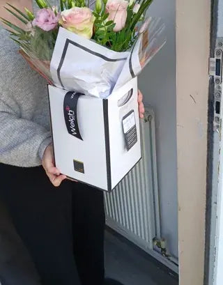 Pale pink roses in a Welch gift box