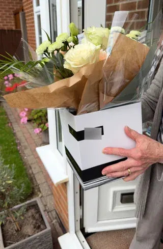 White roses in a Welch gift box