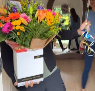 A colourful Welch bouquet and celebration balloons
