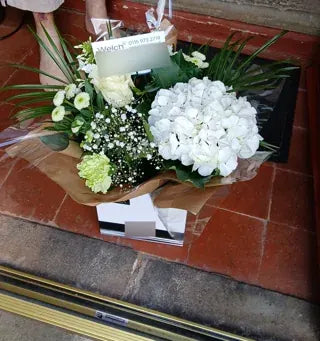 White hydrangea and roses in a Welch gift box
