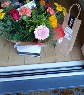 Mixed colourful flowers with a Welch gift bag