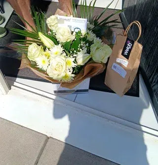 White roses and daisies in a Welch gift box