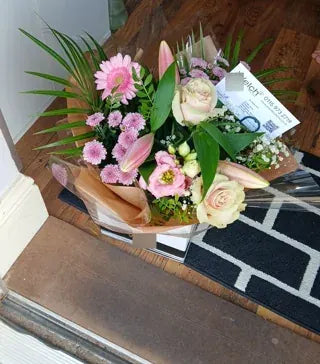 Pink flowers and pale roses in a Welch gift box