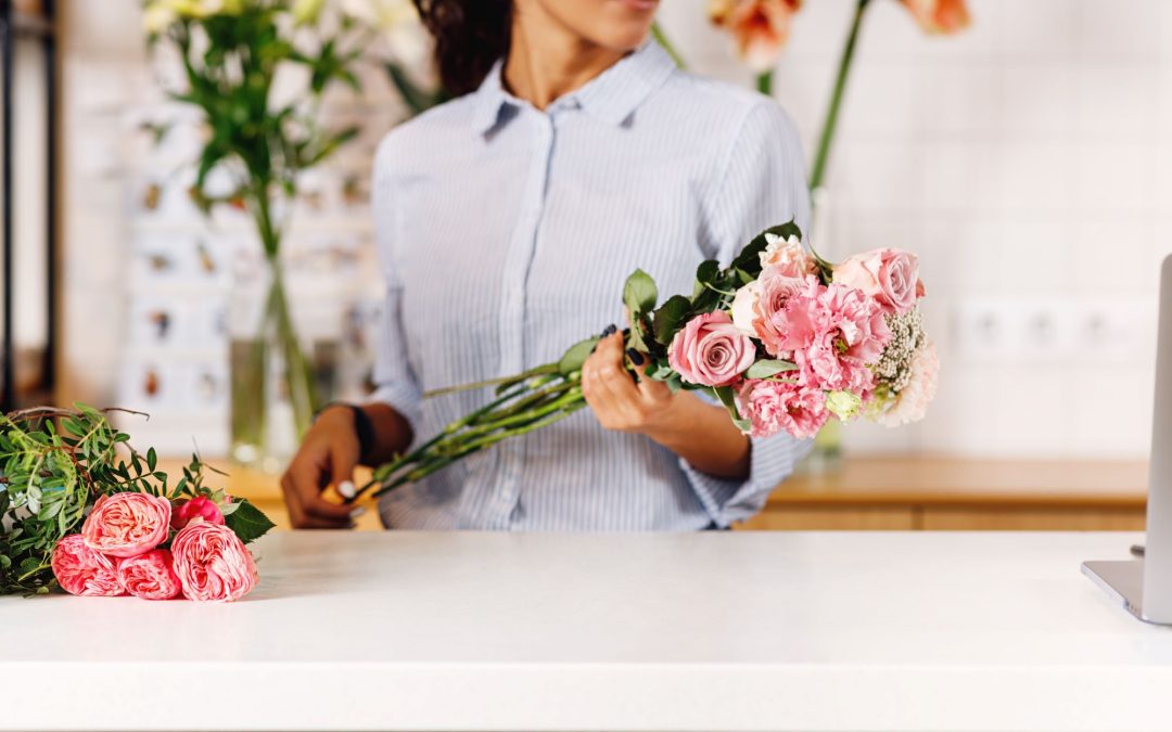 unrecognizable woman holding a flowers at counter 2023 11 27 05 13 26 utc