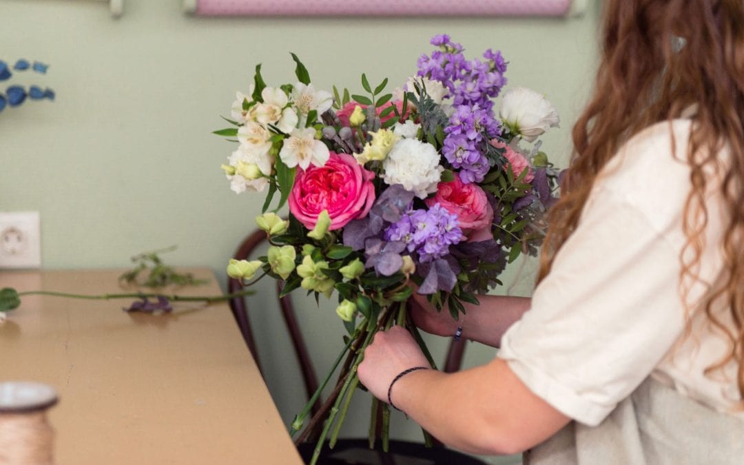 young woman florist with bouquet at her work place 2023 11 27 05 28 07 utc